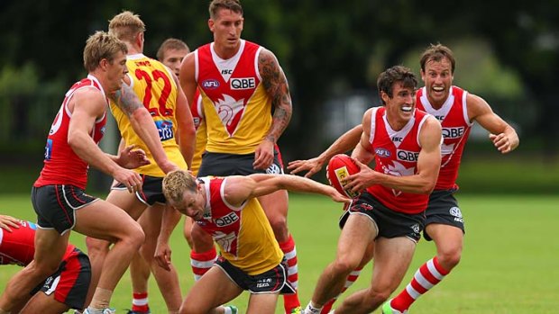 Scaling the heights: Dean Towers (with ball) shows his style for the Swans in an intra-club practice match.