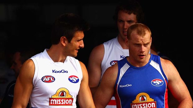Adam Cooney leads players out for a training session at Whitten Oval yesterday.