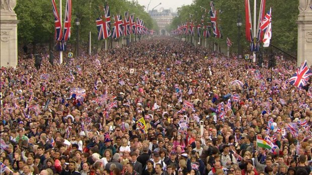 March of history ... spectators move down the Mall, toward Buckingham Palace.