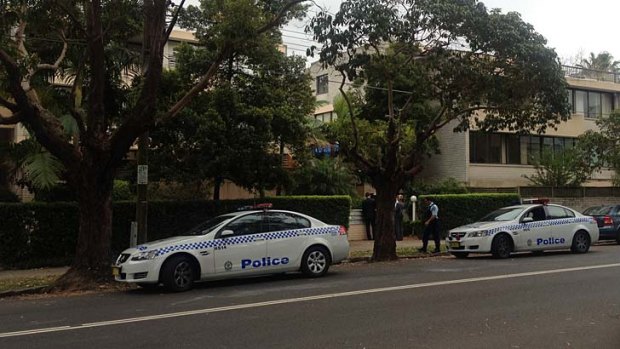 Police gather at a Neutral Bay unit where there was a fatal stabbing early on Sunday.