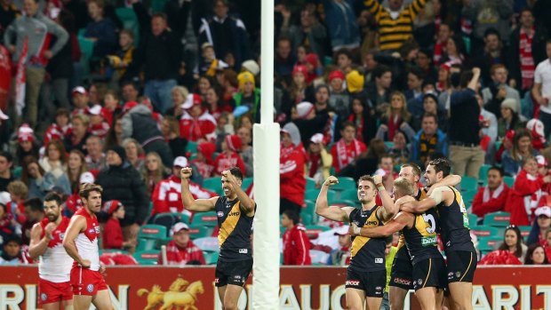 Big win: Jack Riewoldt of the Tigers and teammates celebrate winning at the SCG.