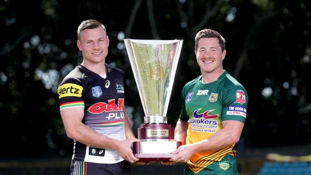 Wyong captain Mitch Williams (right) and Penrith skipper Darren Nicholls hold the NSW Cup, which their sides will fight for on Sunday.