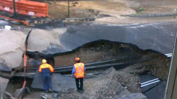 A burst water main has caused a huge hole in the road in Paddington.