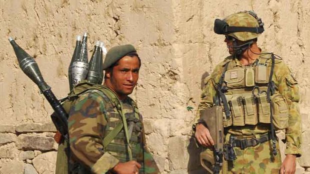 Corporal Brett Clarke on patrol with Afghan National Army soldier.