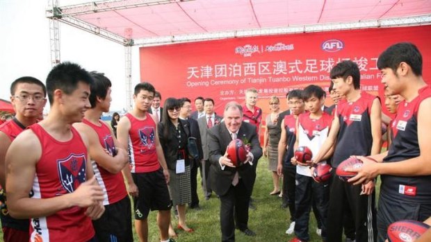 Lord Mayor Robert Doyle, doing his bit for Melbourne, in China for the launch of a $1.5 million AFL football oval in Tianjin.