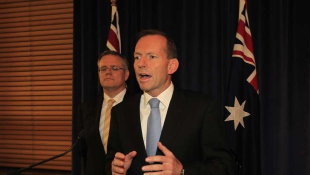 Policy standstill ... opposition Leader Tony Abbott with shadow immigration minister Scott Morrison, above.