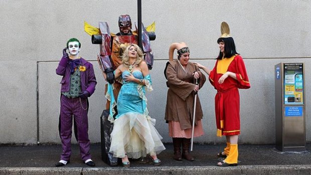 Cosplay fans: Peter Stein aka the Joker, left, Darrell Johnson aka Rodimus Prime, Rebecca Mcintosh aka Aphrodite of Love TV, Kat Twi’lek aka Scarl and Thomas Kuzma aka Emperor Kuzco, pose in Parramatta to promote the upcoming Sci-Film Film Festival.