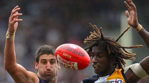 High-flyers: West Coast's Dean Cox (left) and Nic Naitanui form an awesome ruck combination for the Eagles.