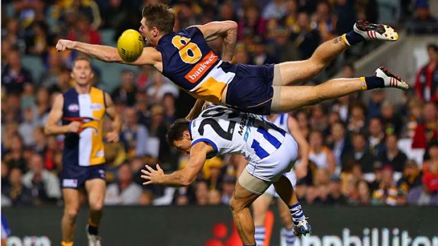 Going for the punch: West Coast's Beau Waters tries to spoil the mark for Brent Harvey.