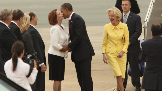 Quentin Bryce and Julia Gillard greet Barack Obama at Canberra Airport.