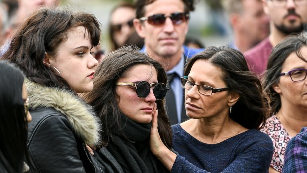 Mourners on Friday at a memorial for victims of the Essendon Airport plane crash. 