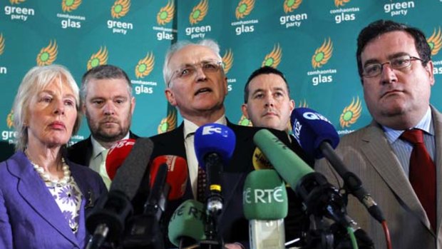 Split ... the Greens leader, John Gormley, joins his colleagues to announce his party's withdrawal from the Fianna Fail coalition.