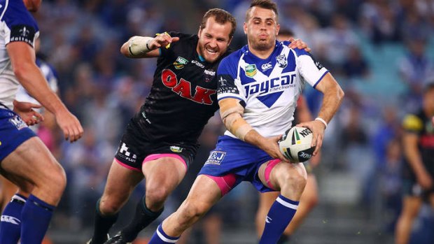 On the move: Josh Reynolds looks for support.