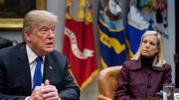 President Donald Trump's (seen here with Secretary of Homeland Security Kirstjen Nielsen) decision to end the protected status for Salvadorans is part of his broader push to tighten immigration laws and expel those living in the US illegally. 