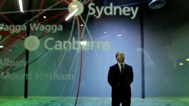 Man in the middle ...  Alan Joyce pauses to reflect yesterday after telling a Sydney press conference that Qantas flights were about to resume.