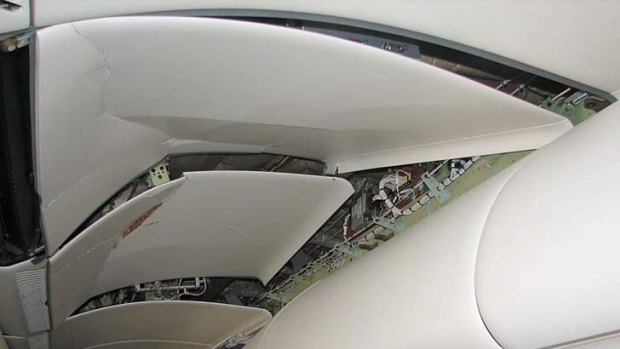 Damage to the fittings above passenger seats caused by the plunge of the Qantas flight.