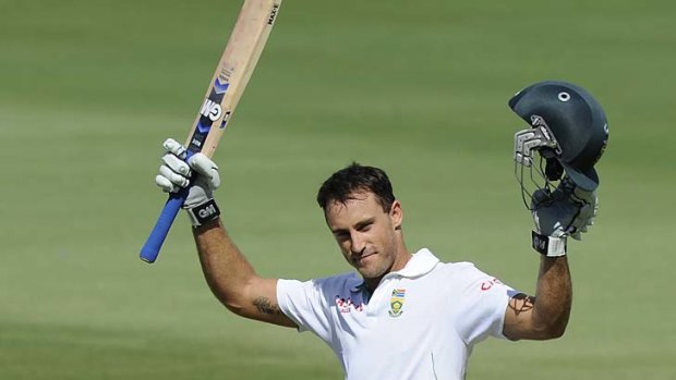 Faf du Plessis of South Africa raises his bat after scoring his heroic century.