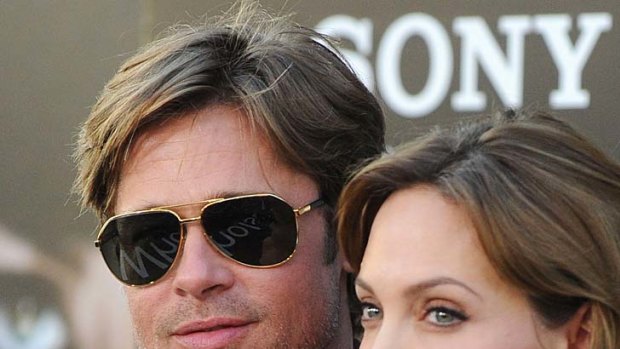 It's just not the same ... Brad Pitt and Angelina Jolie arrive at a movie premiere.