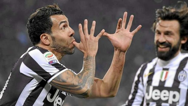 Blow your own trumpet: Juventus' Carlos Tevez celebrates after scoring against Torino.