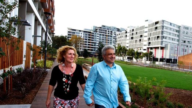 On the move ... Jane and Andy Paschalidis in front of Divercity in Waterloo where they have bought a two-bedroom apartment off the plan for $648,000.