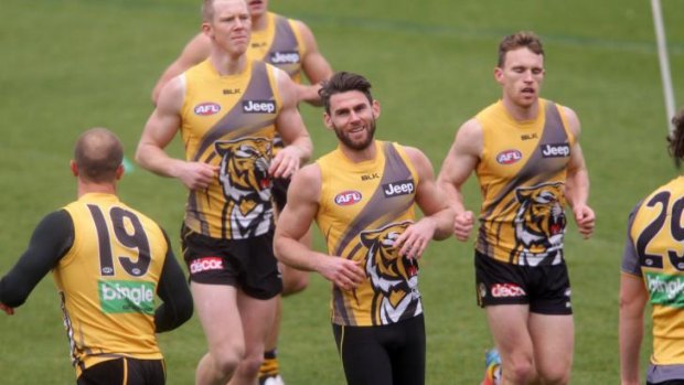 Tigers ace: Chris Newman (centre) wants to play on next year if his body allows it.