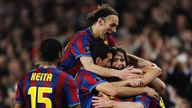 Eyes on the prize: Barcelona celebrates on its way to victory in 2011.