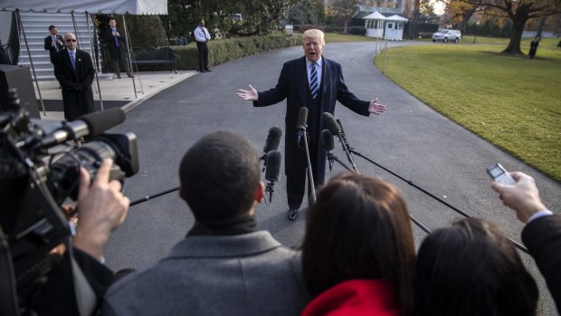 Donald Trump speaks to members of the media before leaving DC for New York.