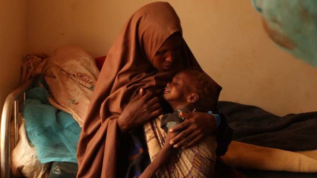 Urgent case ... Halima Hussain carried her one-year-old son Muhammad for 23 days, through a harsh environment plagued by Somali bandits and wild animals, to reach the safety of Dadaab. With his orange-tinged hair and big black eyes, her little boy's appearance gave away his poor health.