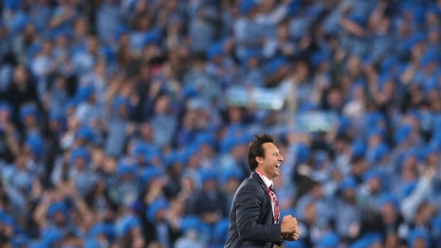 Job well done: Laurie Daley celebrates the Blues' drought-breaking Origin series win in June.