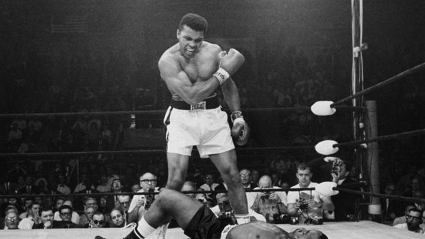 Ali standing over fallen challenger Sonny Liston: To evoke Ali's image in their marketing, companies have been using archival footage, photos, audio and his sayings.