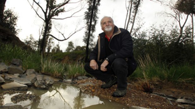 Leigh Speechley next to a creek on his Kilmore East property after the chemical simazine was found in waters that form part of the Goulburn River catchment.