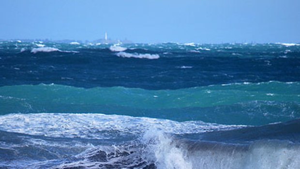 Cottesloe's beach pylon was snapped by the strong seas swept up by the storms that lashed WA overnight.