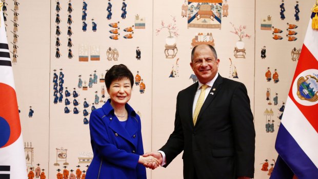 Costa Rican President Luis Guillermo Solis, right, shakes hands with South Korean President Park Geun-hye last year.