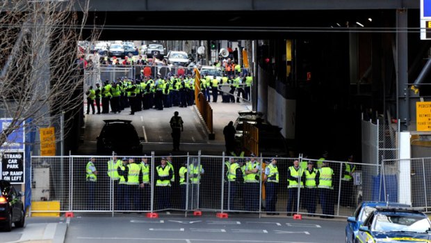Taking control ... Police at the Grocon building site at Lonsdale Street this morning after using an RDO to wrest back control from blockading workers in a late-night operation.