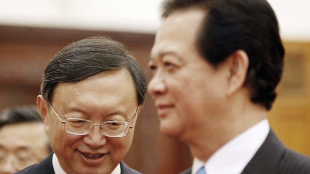 Chinese State Councillor Yang Jiechi (left) smiles during a meeting with Vietnamese Prime Minister Nguyen Tan Dung (right) in Hanoi. The meeting was held over the placement of China's oil rig.