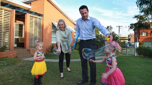 Way in: Kathryn and Shane O'Sullivan with children Alannah (right) and Samantha at their new Brookvale home.
