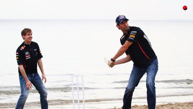 Sebastian Vettel and Red Bull Racing teammate Mark Webber try their hand at beach cricket on St Kilda Beach during previews to the Australian Formula One Grand Prix on March 14, 2012 in Melbourne, Australia.  (Photo by Clive Mason/Getty Images)