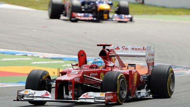 Fernando Alonso leads Sebastian Vettel.