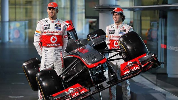 Shining stars &#8230; McLaren teammates Jenson Button and Sergio Perez show off their new car.