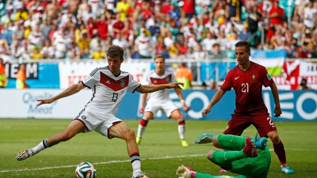 Goal festival continues ... Thomas Mueller of Germany shoots and scores his team's fourth goal and completes his hat trick past Rui Patricio of Portugal.
