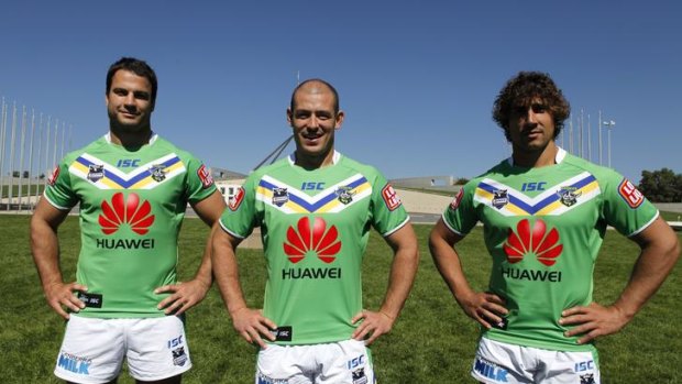 Raiders captain Terry Campese, centre, with David Shillington, left, and Tom Learoyd-Lahrs, right, model the Raiders' new jerseys following yesterday's sponsorship announcement with Huawei.
