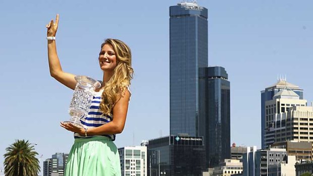 Victoria Azarenka poses by the Yarra River today with the trophy for becoming the women's world No.1 tennis player.