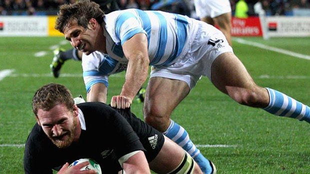 Kieran Read of the All Blacks scores his team's first try.