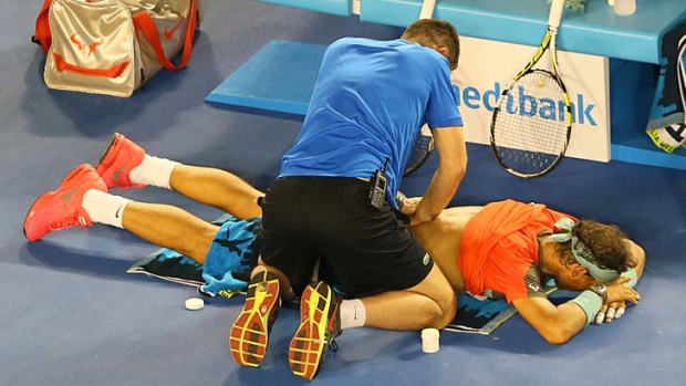 Rafael Nadal gets treated during the men's final against Stanislas Wawrinka.