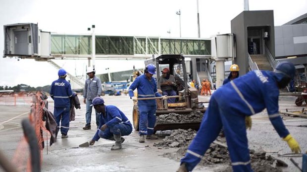 Workers completing renovation and expansion works at Juscelino Kubitschek International Airport.