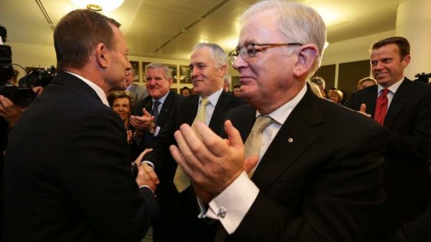 Thanks Mal! Opposition Leader Tony Abbott glad-hands his ministers after a Coalition pow-wow.