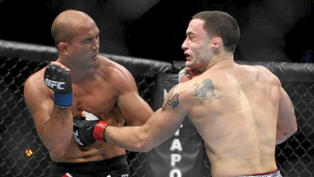 Frankie Edgar, right, lands a blow against BJ Penn during their second UFC lightweight title bout in August, 2010.