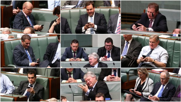 Coalition MPs seem distracted during a division for Education Minister Christopher Pyne's higher education bill.