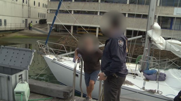 Hamish Thompson is arrested by police after they allegedly seized 1.4 tonnes of cocaine from the yacht Elakha.