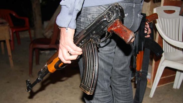 A Kalashnikov, anyone? Some of the military hardware - from handguns to tank-killing recoilless rifles -  for sale in Abu Jihad's Beirut back shed.